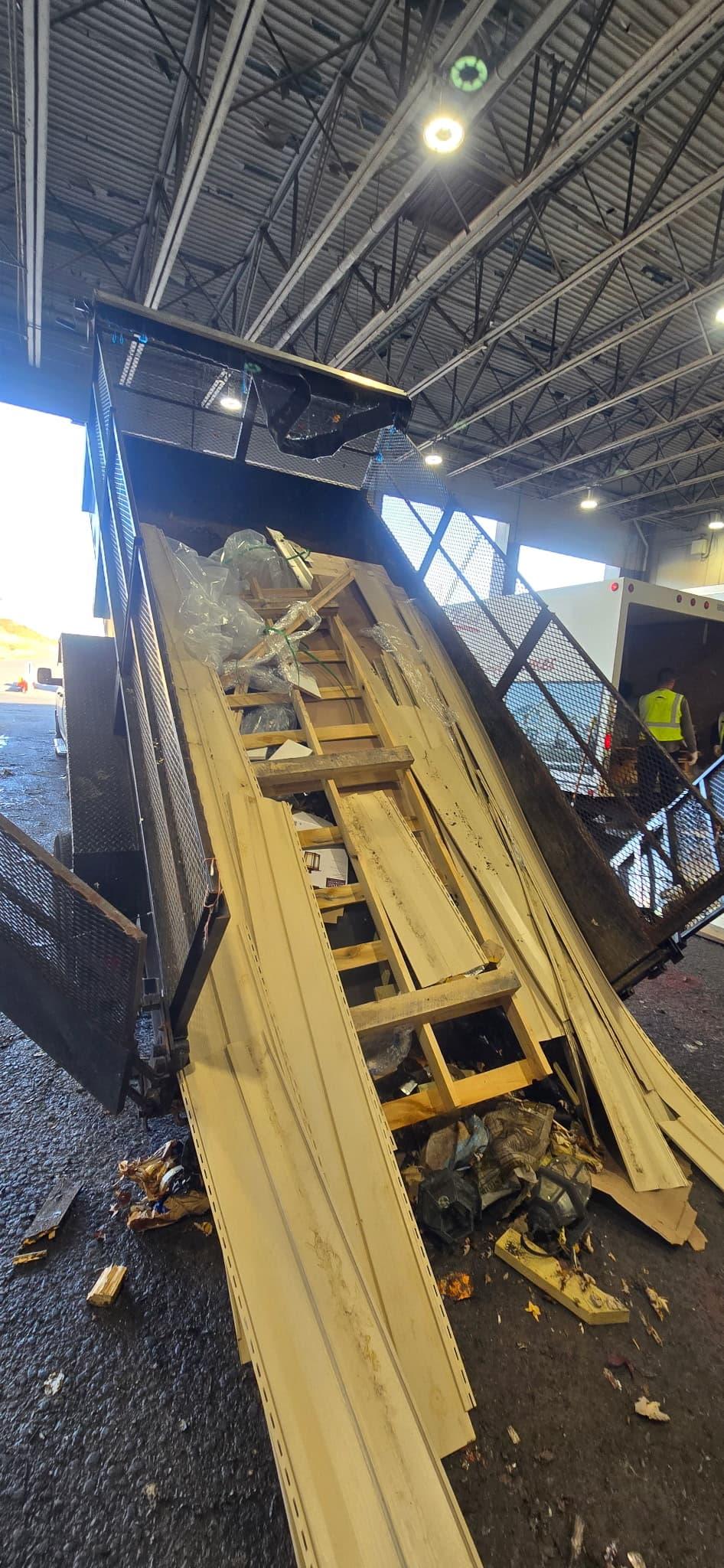 Trailer dumping a completed load of debris